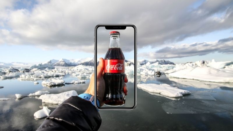 viewing a bottle through a phone camera in augmented reality.