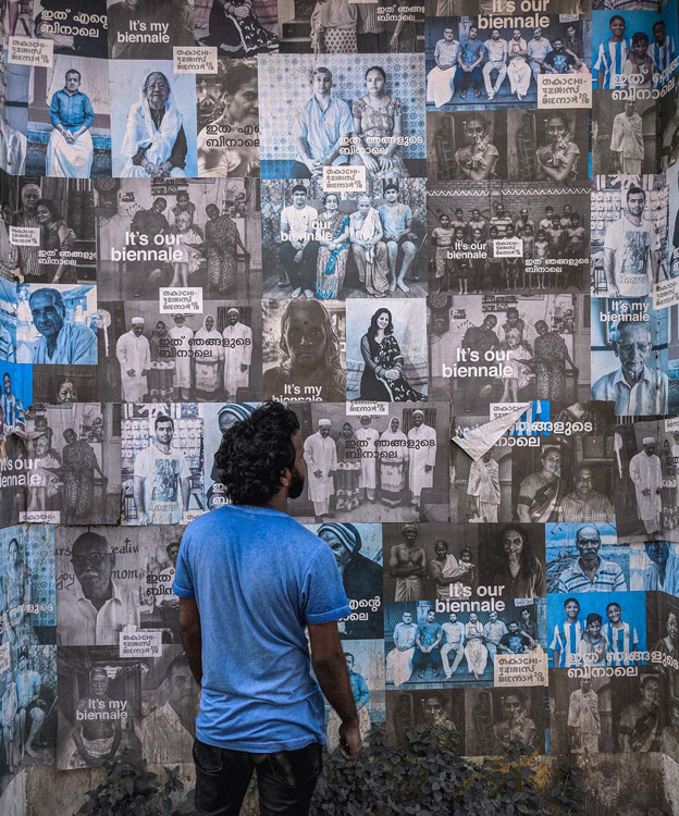 a man deeply engaged looking at posters to signify how customers can be engaged when marketing collaterals are Augmented Reality enabled.